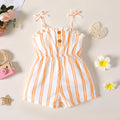 White and orange stripe girls romper with tie straps, ruffle bodice, and wooden buttons, flat lay
