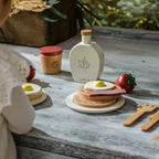 Coco Village wooden brunch playset with pancakes, bacon, egg, and syrup bottle