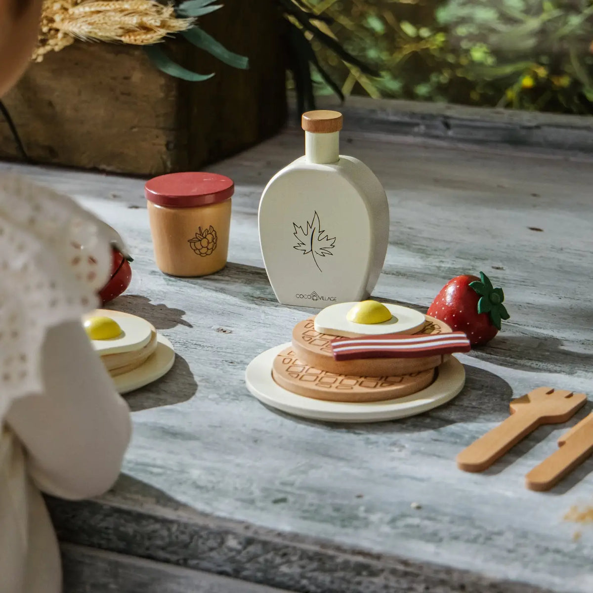 Coco Village wooden brunch playset with pancakes, bacon, egg, and syrup bottle