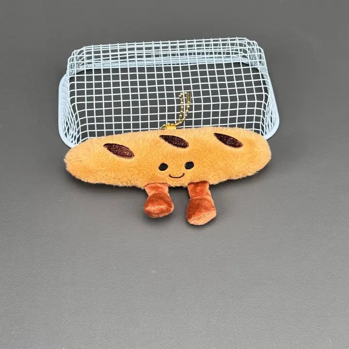 Baguette plush charm with smiling face and corduroy legs