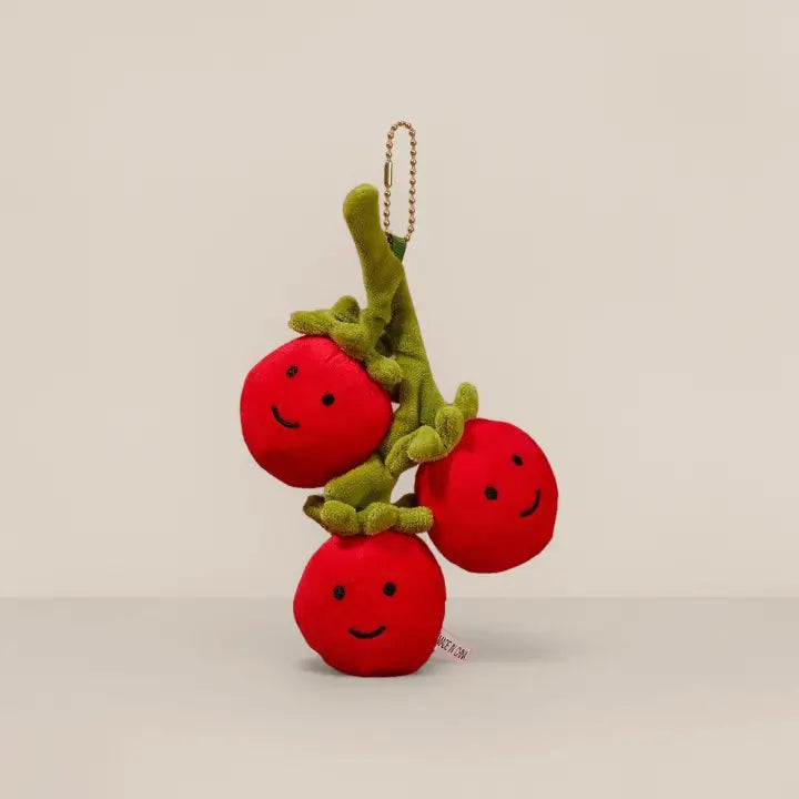 Cherry tomato plush keychain charm with smiling faces on a ball chain
