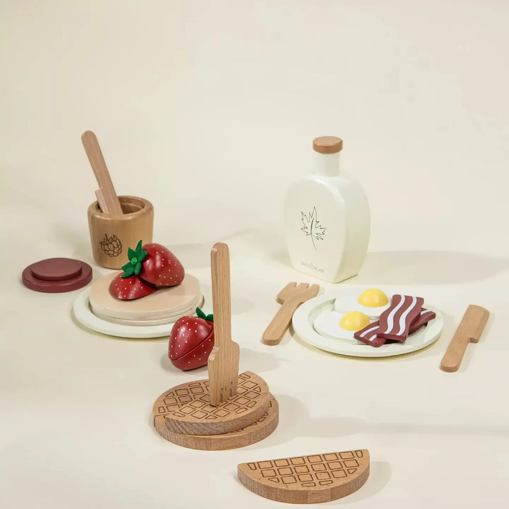 Coco Village wooden brunch playset pieces: waffles, eggs, bacon, syrup, and utensils