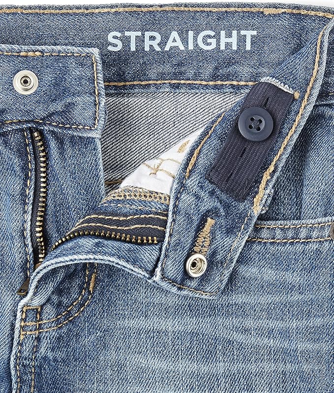 Close-up of boys straight leg jeans waistband with button tab adjustable waist and snap