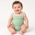 Baby wearing a mint ribbed tie-strap one-piece swimsuit