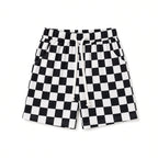 Kids black and white checkered drawstring shorts with pockets, front view