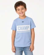 Boy wearing a light blue CHAMP graphic tee