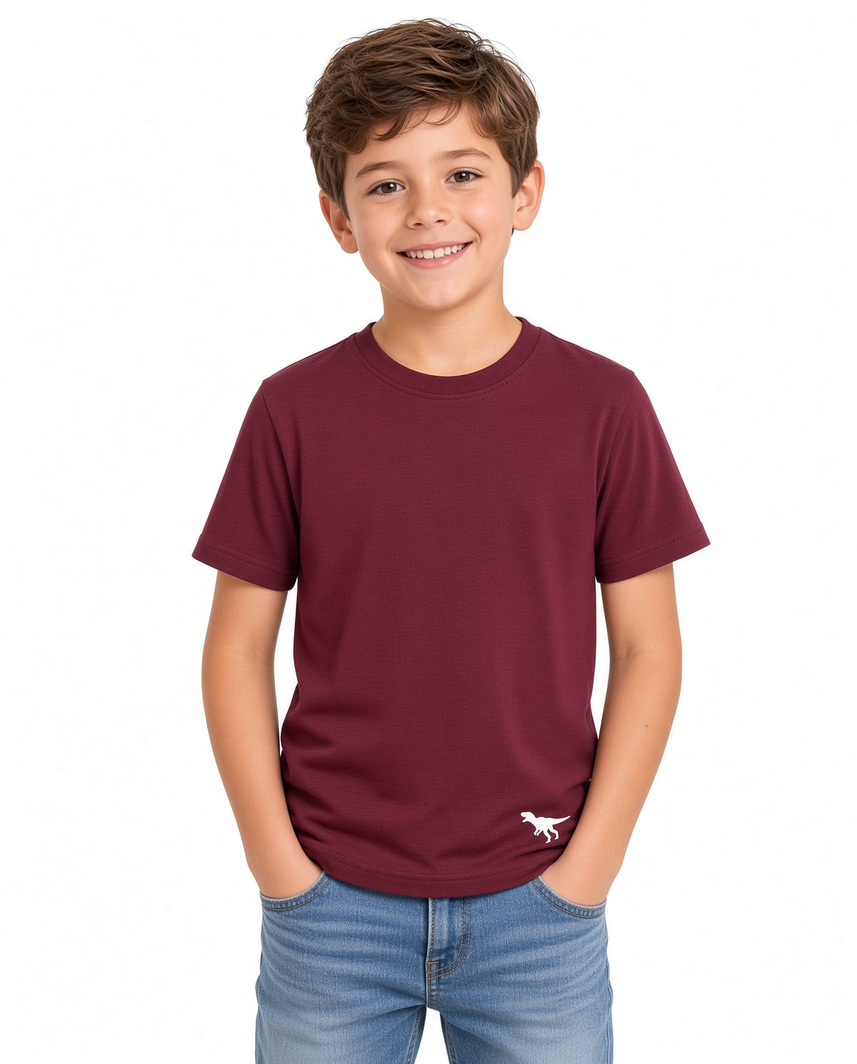 Boy wearing a burgundy solid tee with small dinosaur hem logo