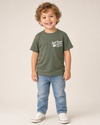 Boy wearing the Little Rad Things Final Track Attack military green tee with jeans