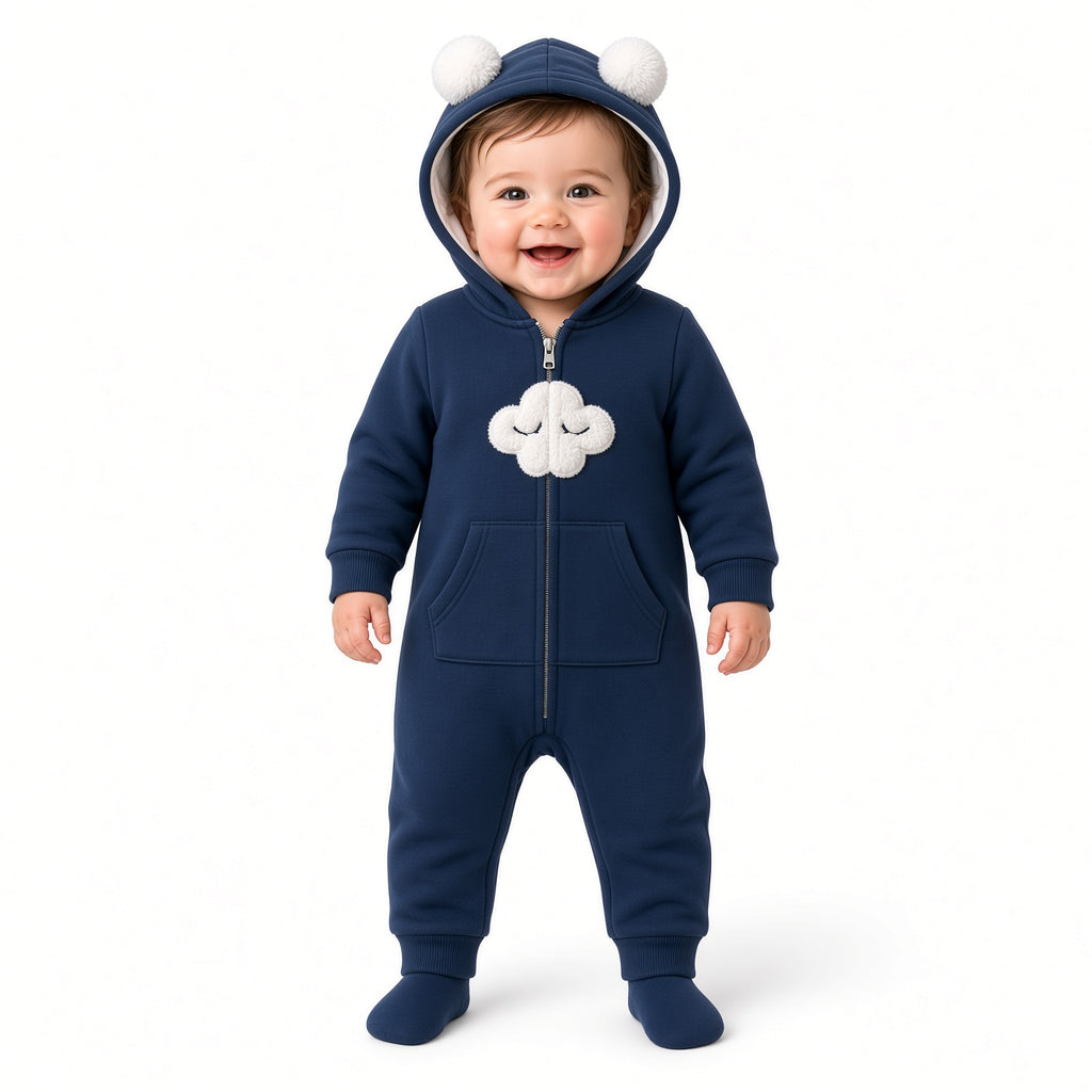 Baby wearing a navy zip-up fleece hooded romper with white cloud appliqué and ear pom-poms