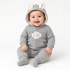 Baby wearing a gray fleece hooded zip romper with cloud appliqué and bunny ears