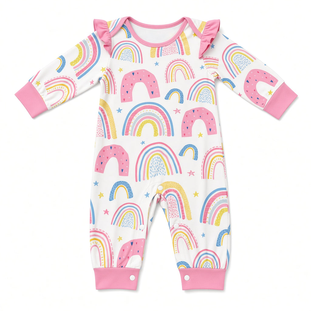 White baby romper with pastel rainbow print, ruffle shoulders, and pink cuffs, front view