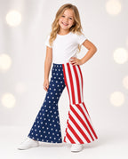 Girl wearing American flag bell-bottom pants with stars and stripes legs