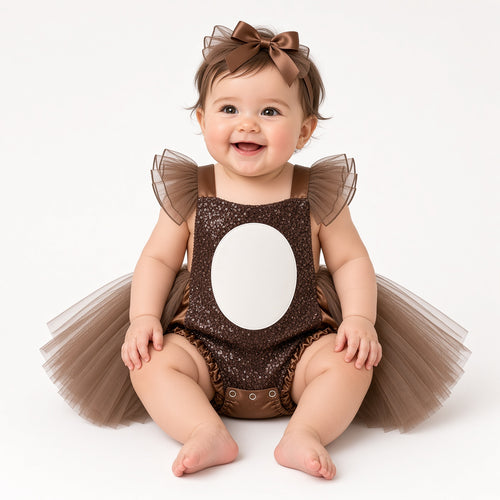 Baby wearing a brown sequin teddy bear tutu romper with white belly and bow