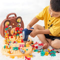Child using a toy drill on the bear-face play toolbox with colorful screw pieces