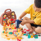 Child using a toy drill on the bear-face play toolbox with colorful screw pieces