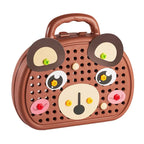 Brown bear-face play toolbox with handle and pegboard front, closed view