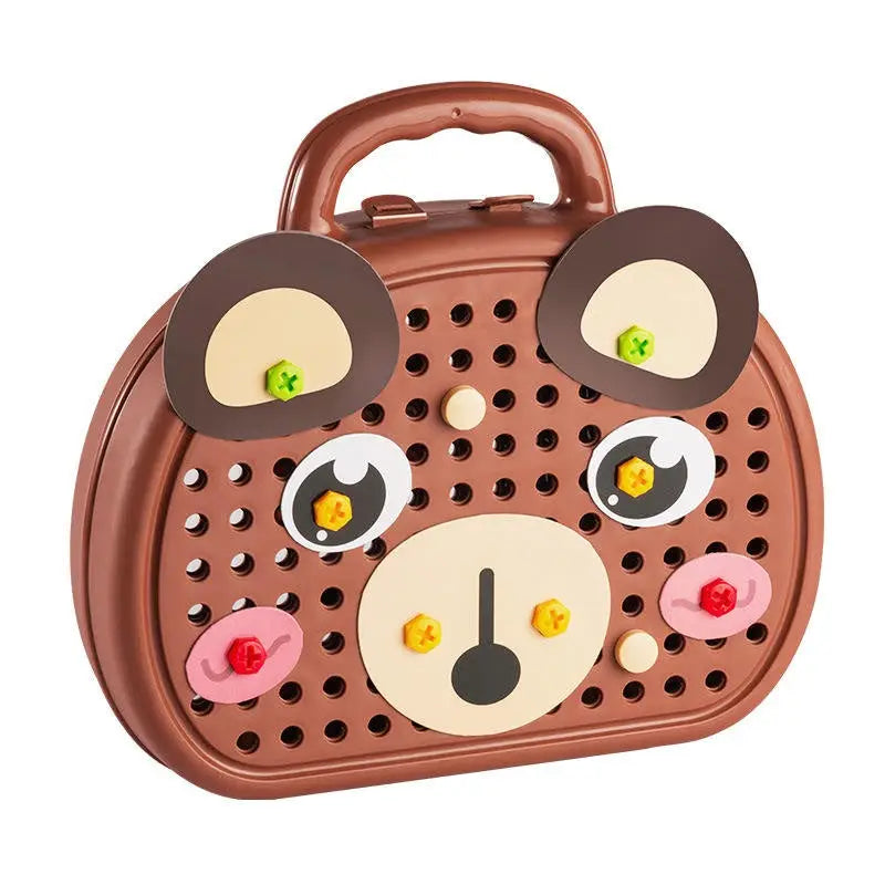 Brown bear-face play toolbox with handle and pegboard front, closed view