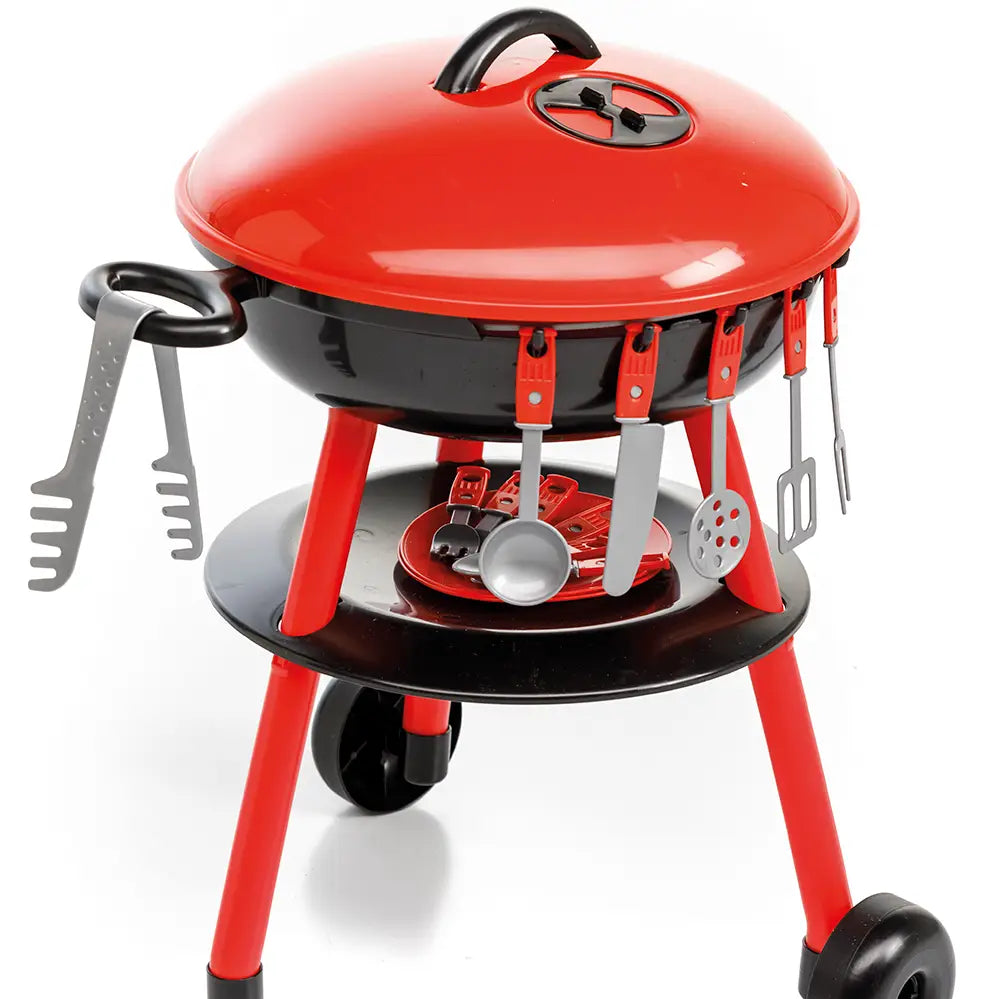 Paradiso Toys kids kettle grill with red lid, hanging utensils, lower shelf, and wheels