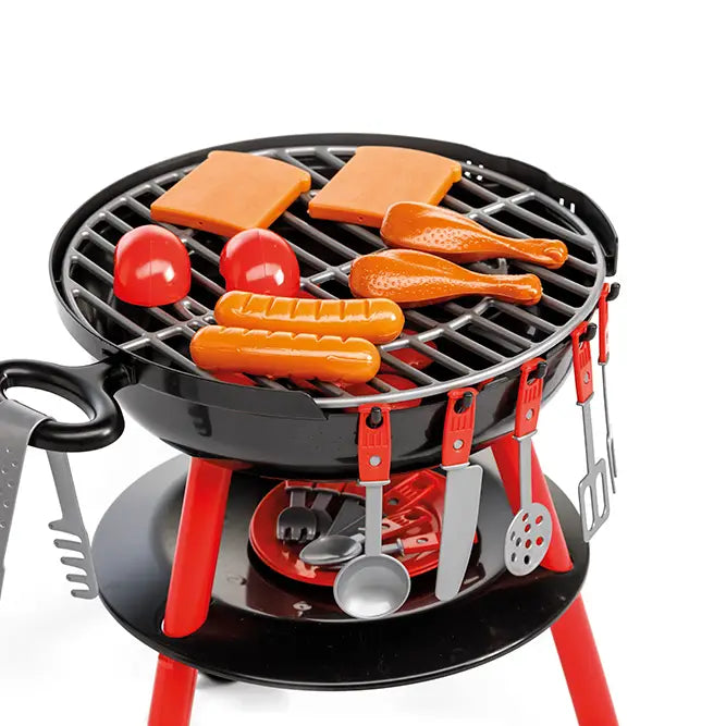 Close-up of toy BBQ grill grate with play sausages, drumsticks, bread, and tomatoes