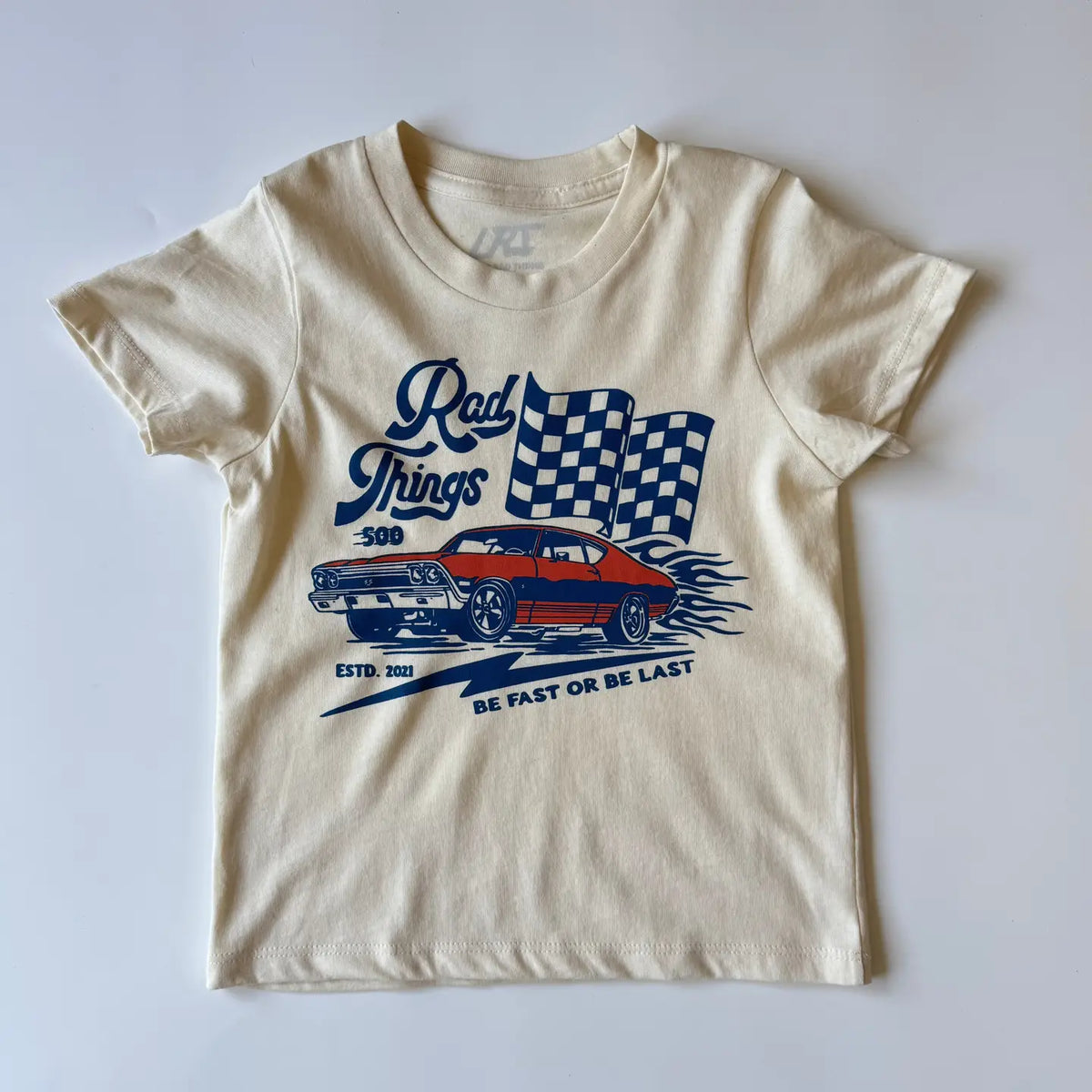 Rad Things 500 natural cream kids tee with race car and checkered flag graphic