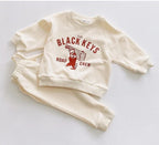 Beige The Black Keys Road Crew toddler sweatsuit, sweatshirt and joggers flat lay
