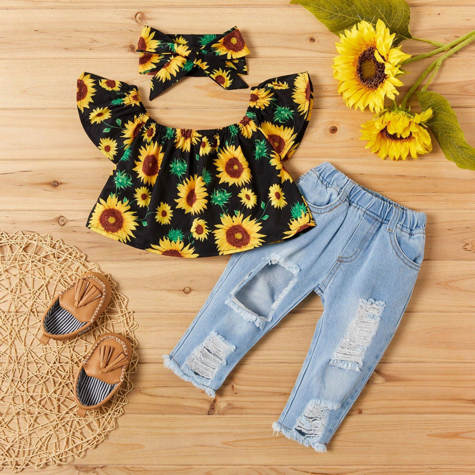 Toddler sunflower print off-shoulder top, distressed light-wash jeans, and matching headband, flat lay