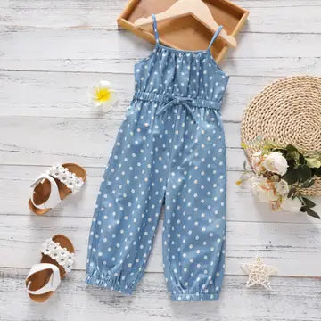 Girls blue polka dot spaghetti-strap jumpsuit with tie waist on a hanger, full length