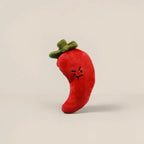 Red chili pepper plush charm with a grumpy face