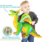 Child holding Drevnar the 29-inch rainbow dragon plush