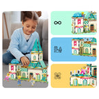 Girl building a magnetic tile castle with example PicassoTiles castle builds
