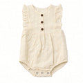 Cream eyelet bubble romper with flutter sleeves, brown front buttons, and snap bottom, front view