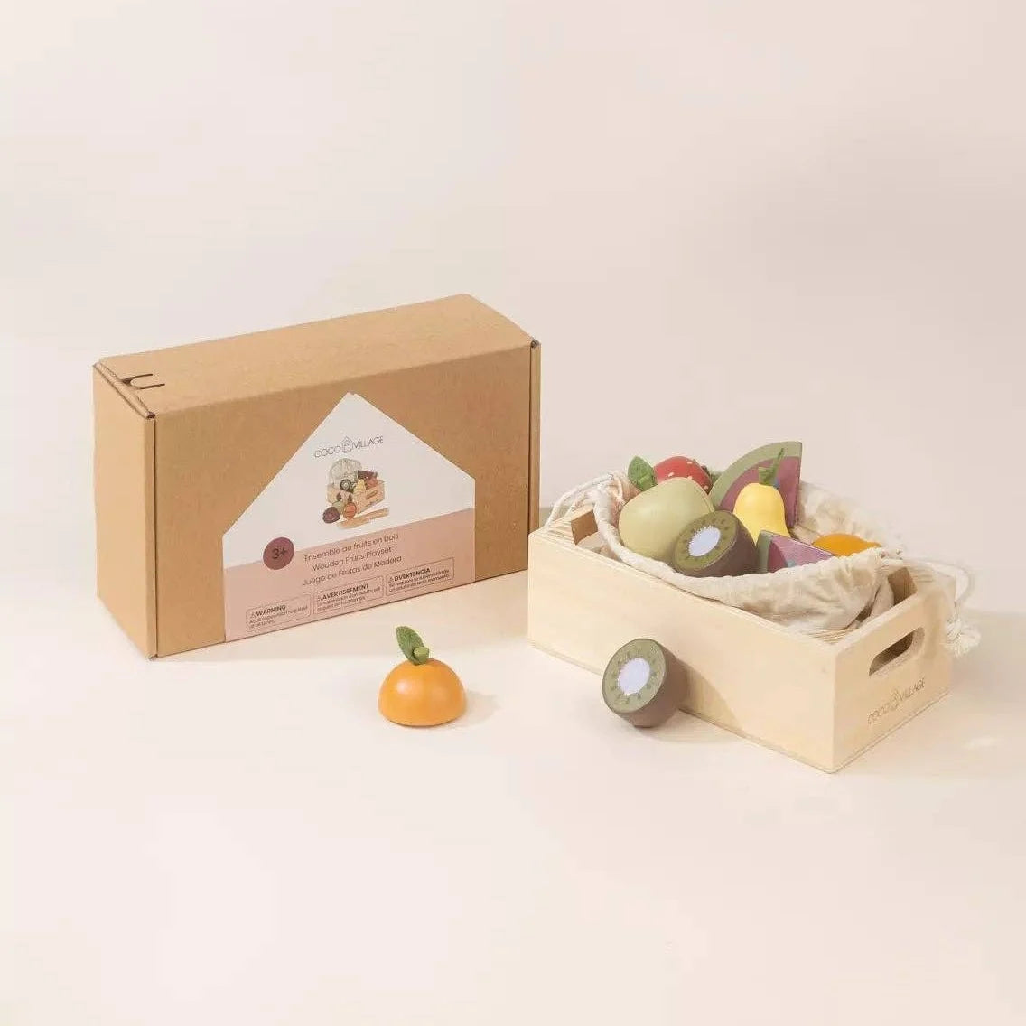 Wooden fruits playset box next to the crate of play fruit